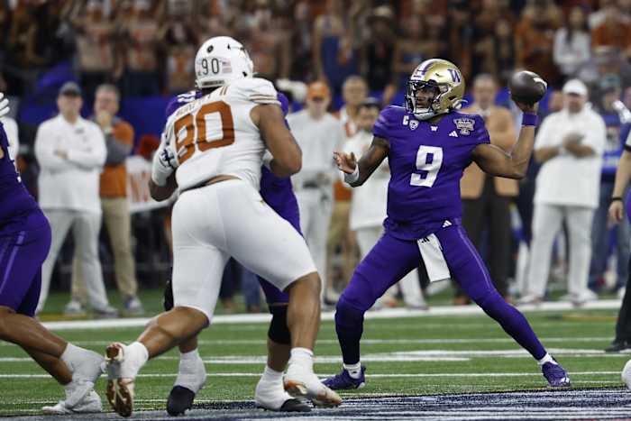 Jan 1, 2024; New Orleans, LA, USA; Washington Huskies quarterback Michael Penix Jr. (9) passes the ball as Texas Longhorns defensive lineman Byron Murphy II (90) chases in the 2024 Sugar Bowl college football playoff semifinal game at Caesars Superdome. Mandatory Credit: Geoff Burke-USA TODAY Sports  